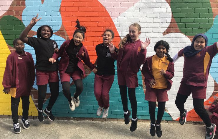 Dandenong West Primary School students in front of public art