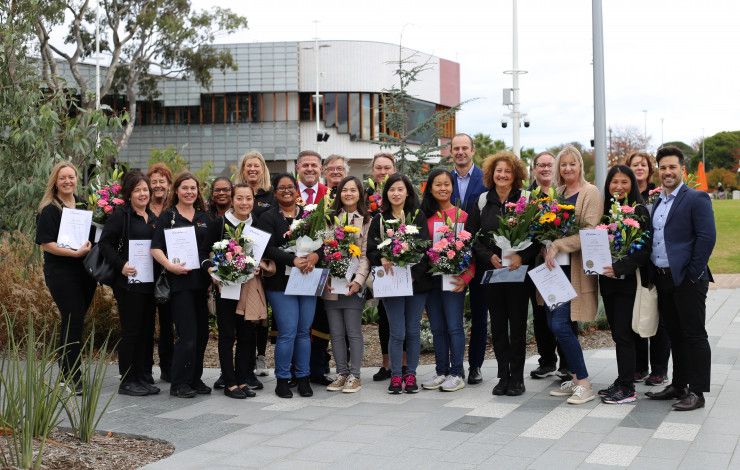 Mayor Jim Memeti with a large group of graduates Council workers.