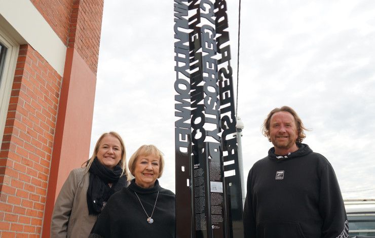 Family of Paddy O'Donoghue with the Noble Park Public Hall sign