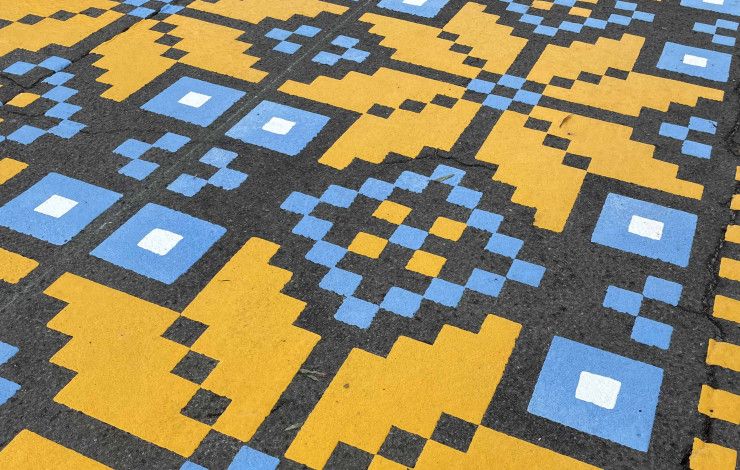 Blue and yellow stenciled mural.