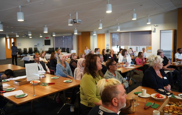 a group of people at a conference 