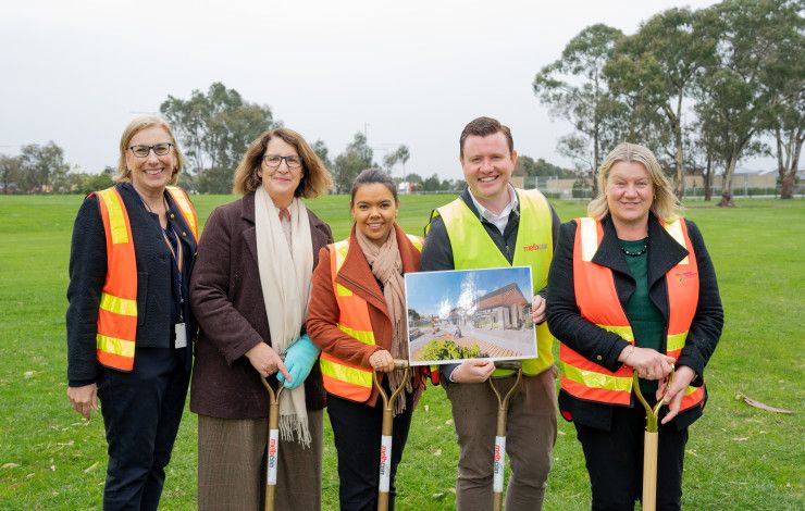 image of people in high vis with shovels