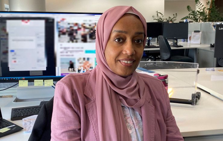 a person sitting at a computer 