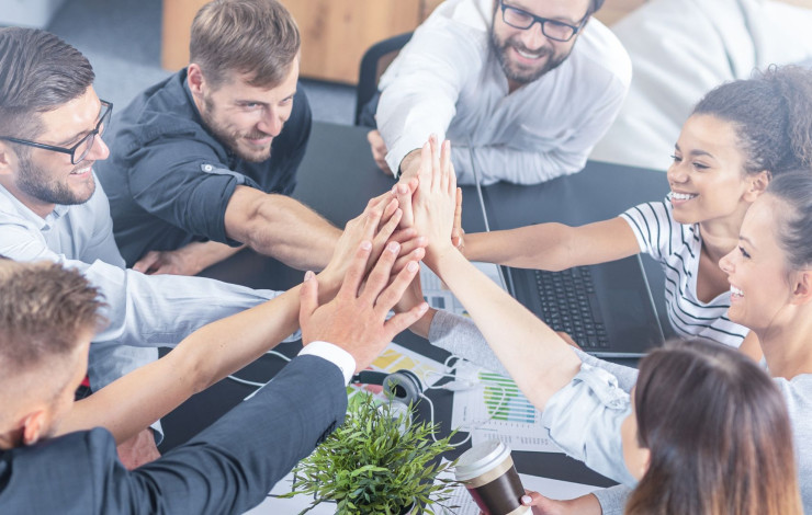 corporate staff having a high five