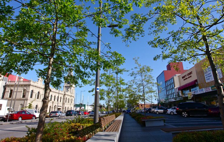 A street with cars and buildings in Dandenong