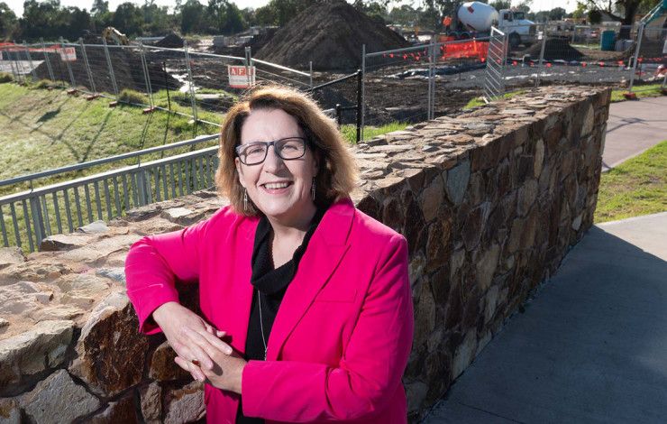 Councillor Rhonda Garad leaning against a brick wall