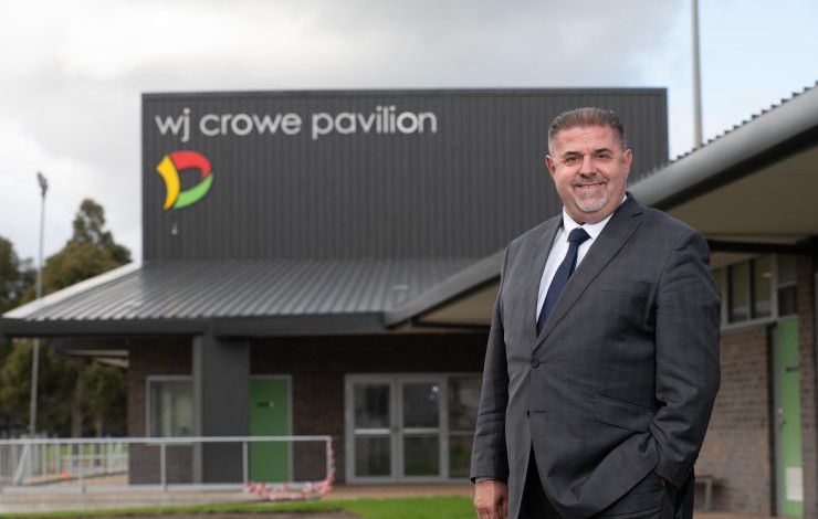 Jim Memeti in front of WJ Crow Paviliam building