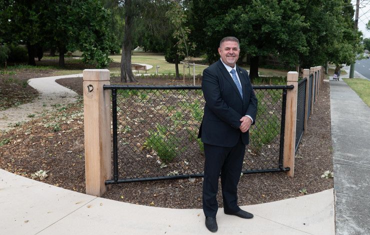 Cr Jim Memeti standing at a park