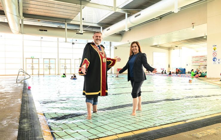 Mayor Cr Jim Memeti and Deputy Mayor Cr Sophie Tan in a swimming pool