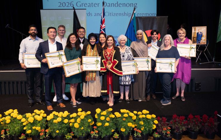 A large group of people all holding awards and smiling at the camera