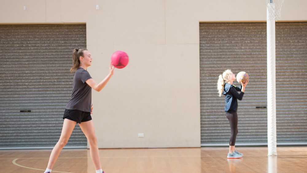 Girls playing netball
