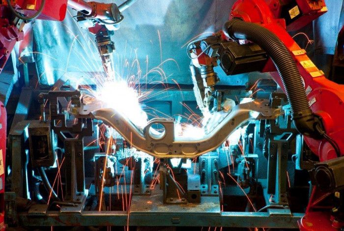 robots welding a component