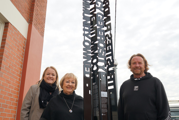 Family of Paddy O'Donoghue with the Noble Park Public Hall sign