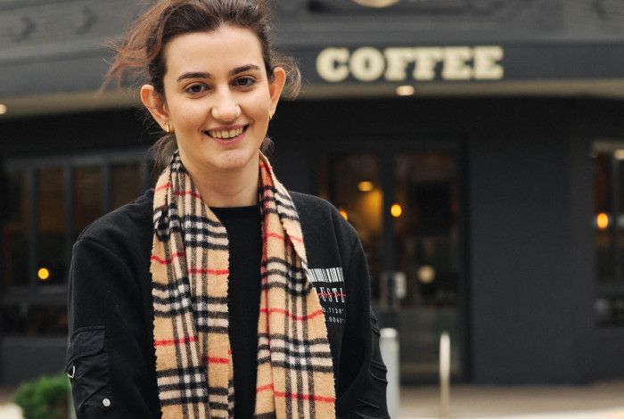 Lady in front of coffee shop