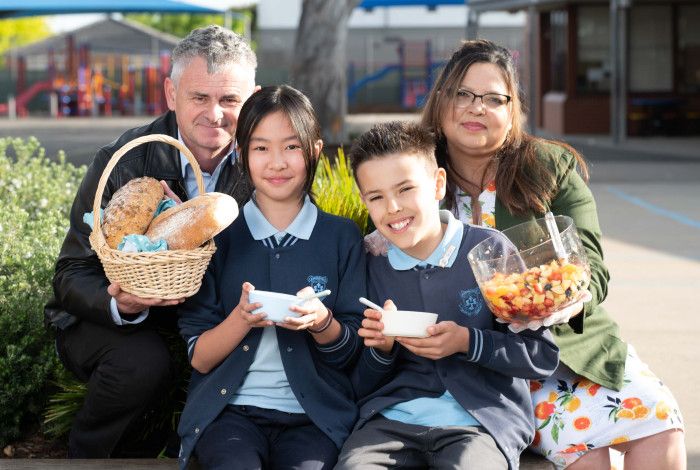 Teachers and students share a healthy breakfast