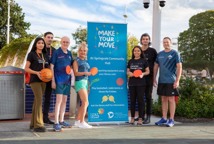 people holding sports equipment outside