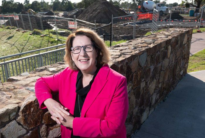 Councillor Rhonda Garad leaning against a brick wall