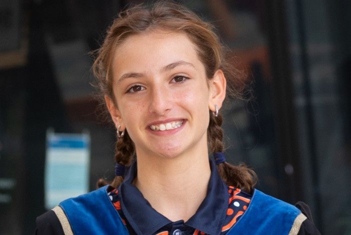 junior may in robes with medal