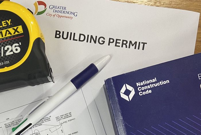 Papers, pen and measuring tape