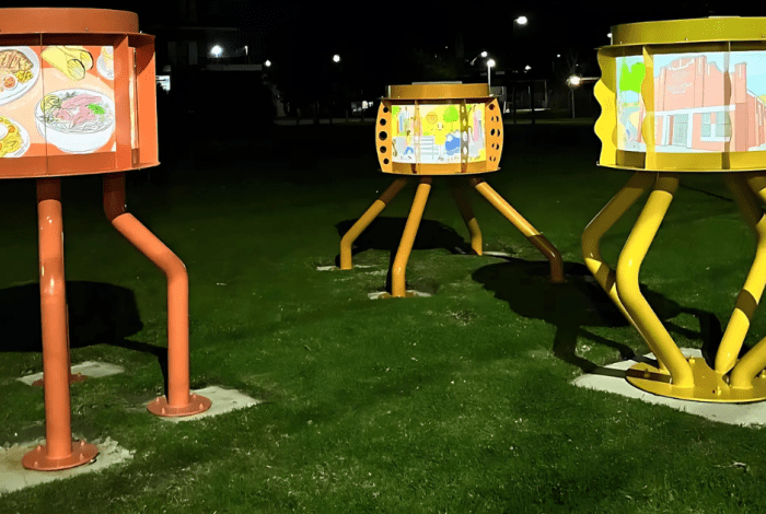 Three pudding lanterns at night in the park.