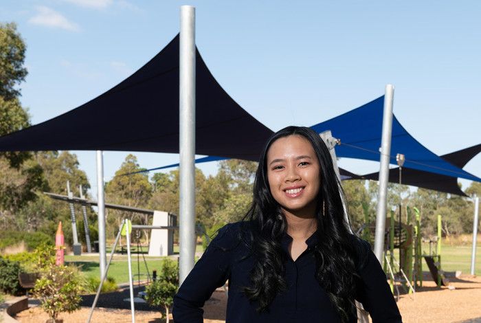 Cr Isabella Do standing in a park