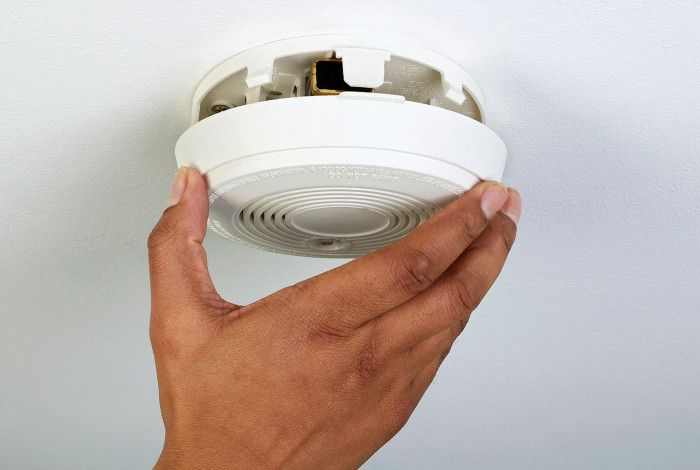 Smoke alarm being installed