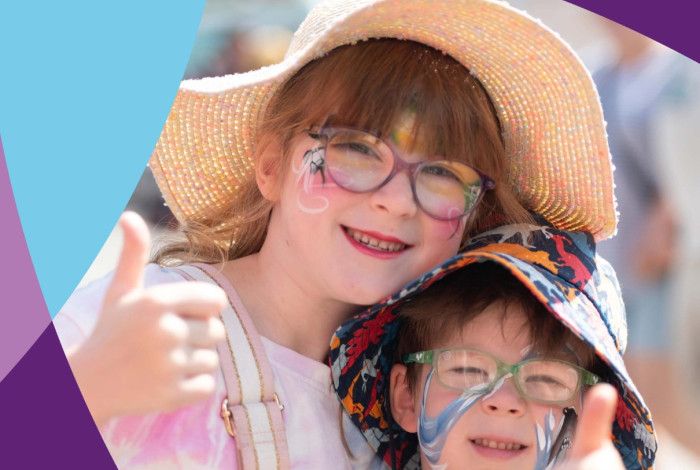 Annual Plan 2025-26 cover with two children at a festival