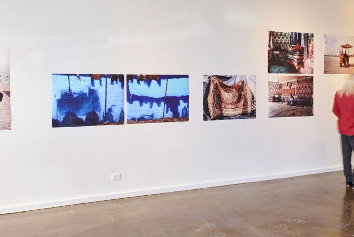 People at the HOME 25 exhibition looking at the artworks