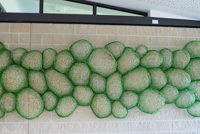 Artwork called Coalescence at Keysborough Community Hub green bubbles hanging on the wall