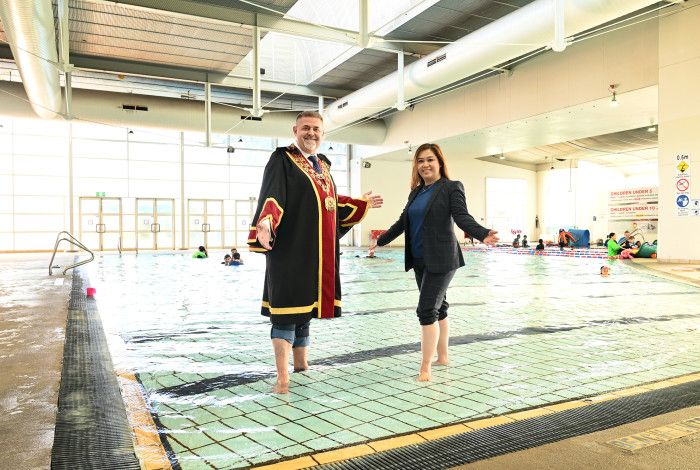 Mayor Cr Jim Memeti and Deputy Mayor Cr Sophie Tan in a swimming pool