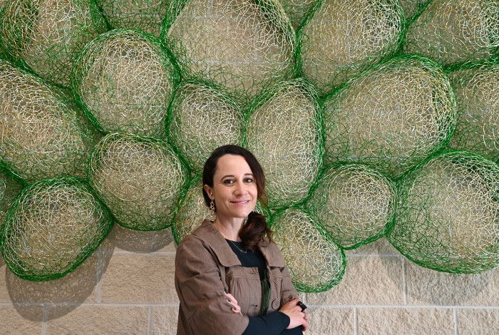 Artist standing in front of public art