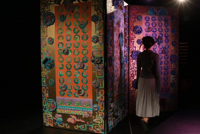 Person walking through The Maze.