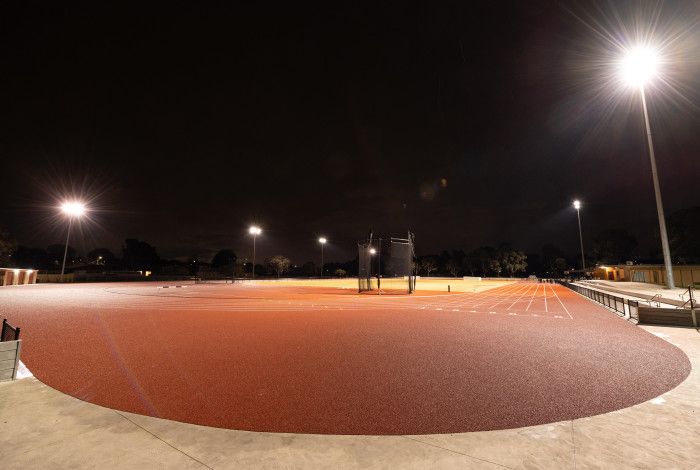 Athletics track lit up at night
