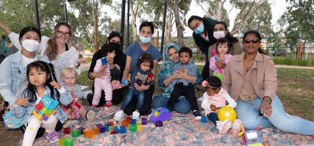 A group of children and mothers enjoying playgroup 