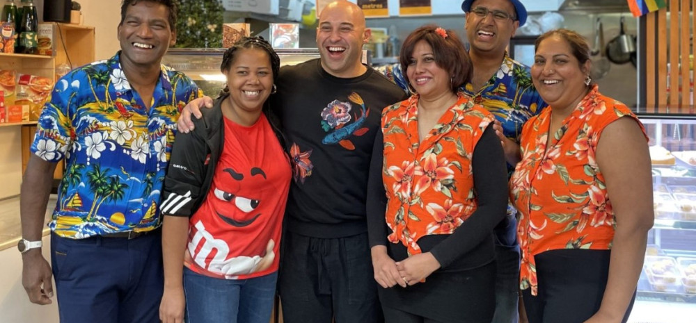 people standing in a market stall
