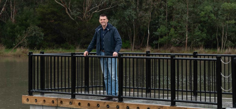 Councillor Bob Milkovic standing on the jetty at Tirhatuan Park