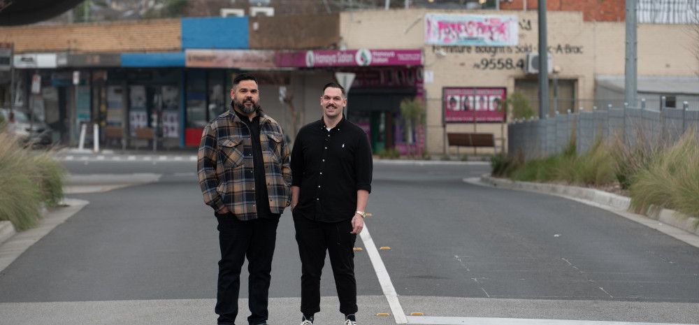Artists Robert Michael Young and Koby Sainty standing in the middle of a road