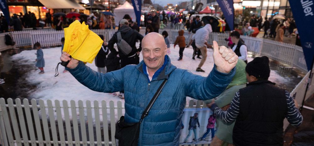 Councillor Sean O'Reilly in front of a snow play area at Springvale Snow Fest