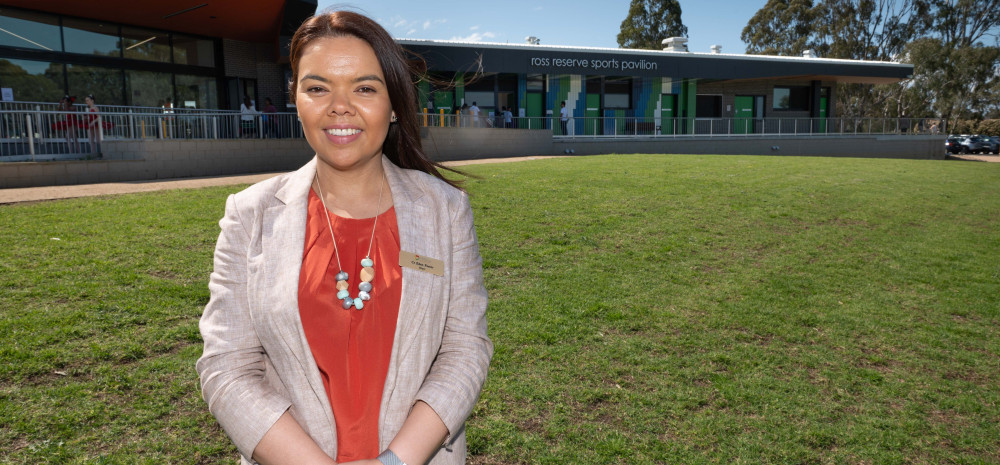 Mayor, Councillor Eden Foster in front of a new sports pavilion