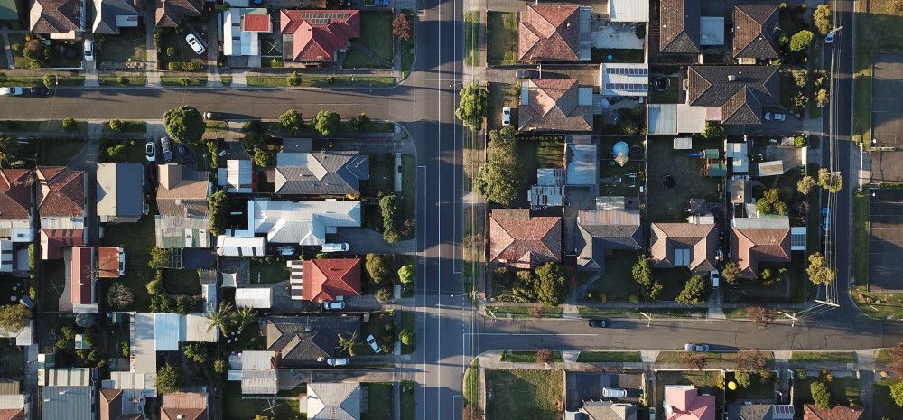 image looking down on house roofs
