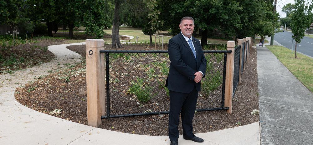 Cr Jim Memeti standing at a park