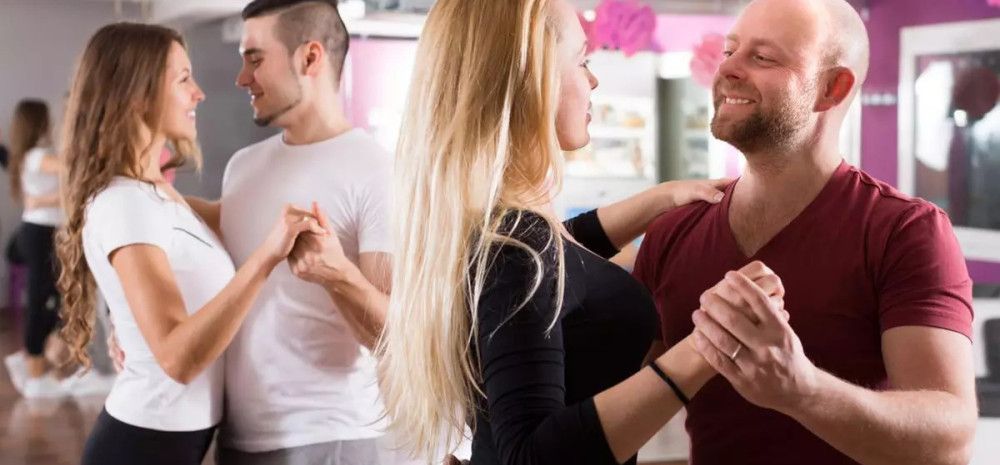 People dancing in couples.