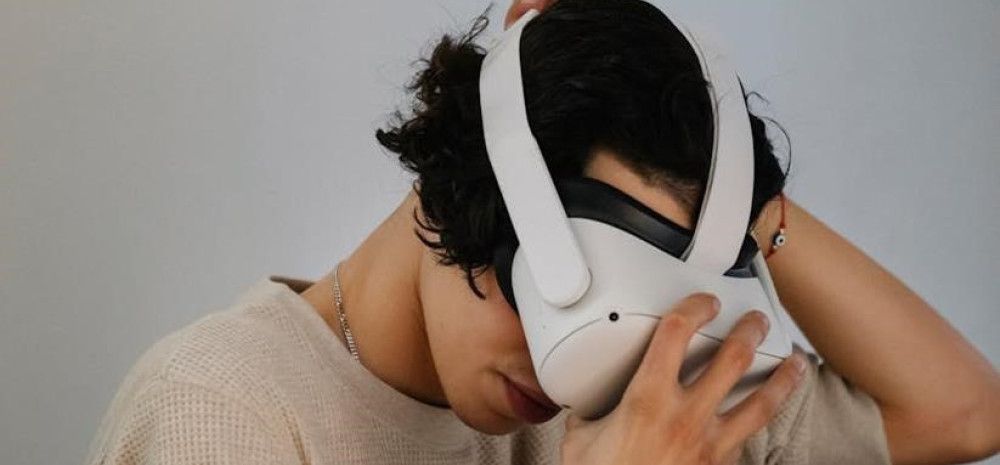 A person putting on a headset