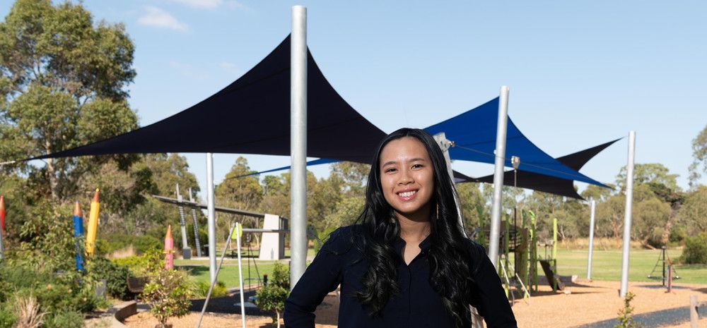 Cr Isabella Do standing in a park