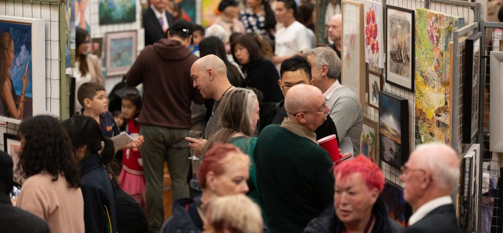 People enjoying an art show.