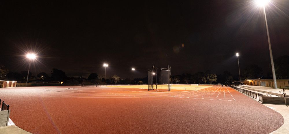 Athletics track lit up at night