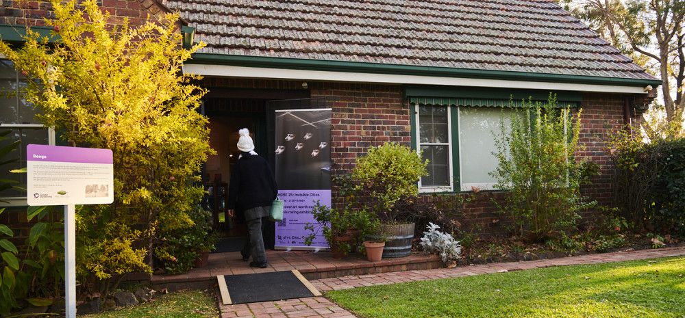 Heritage Hill outside Benga and a person walking inside