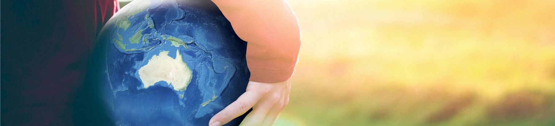 hand holding a globe