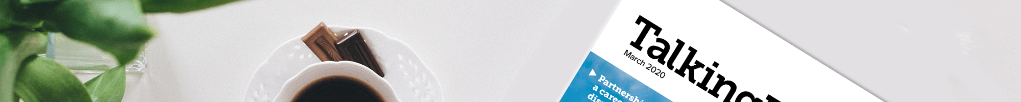 Talking Business magazine on a table with coffee