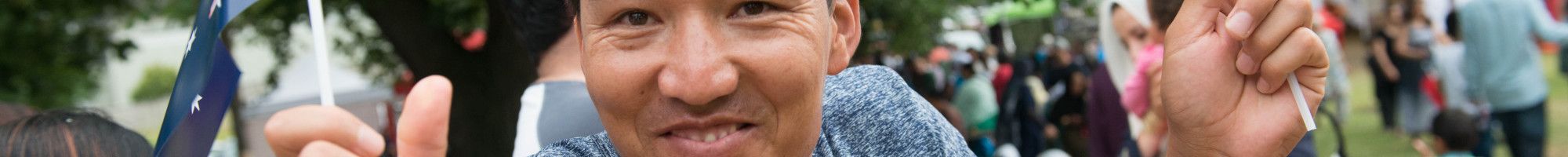 Man with Australian flags celebrating Australia Day